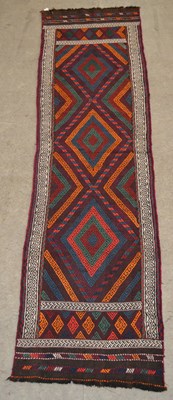 Lot 1213 - An Old Suzni runner, worked in madder, orange,...