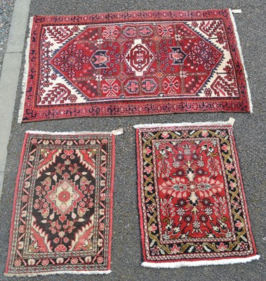 Lot 1227 - A group of three Persian rugs, the largest...