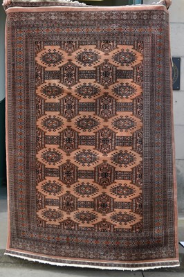 Lot 1220 - A 20th century Tekke type rug, the salmon pink...