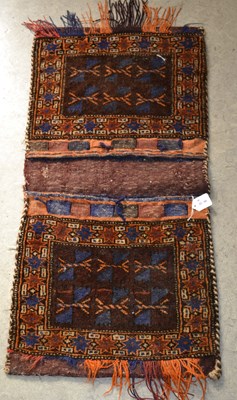 Lot 1226 - A Persian Bakhtiari style saddle back bag,...