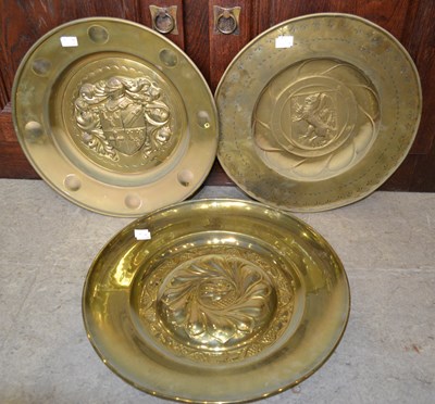 Lot 461 - A group of three decorative brass chargers /...