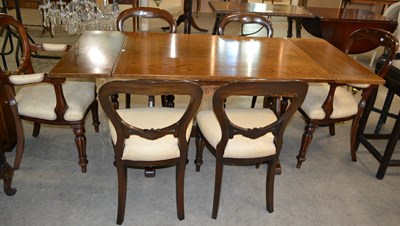 Lot 896 - A 20th century oak refectory draw leaf dining...