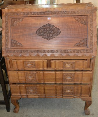 Lot 898 - A 20th century Indian carved wooden bureau...