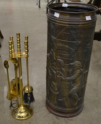 Lot 901 - A four piece polished brass fireplace...