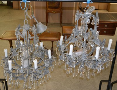 Lot 906 - A pair of six light chandeliers, with...