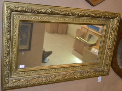 Lot 810 - A 20th century rectangular mirror, held within...