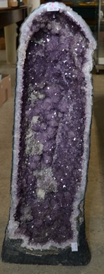 Lot 477 - An amethyst geode specimen, with a deep purple...