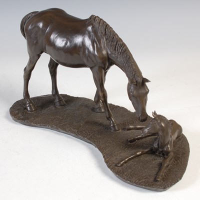 Lot 459 - A bronzed resin mare and foal sculpture,...