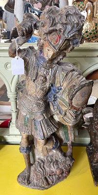 Lot 462 - A polychrome decorated composite stone figure...