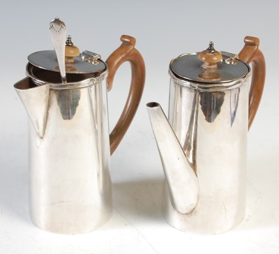 Lot 419 - A silver plated coffee pot, with a brown...