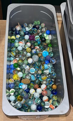 Lot 355 - A box of assorted glass marbles, featuring...
