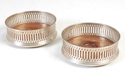 Lot 138 - A pair of London silver modern wine coasters,...