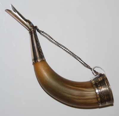 Lot 185 - A Middle Eastern white metal mounted horn, the...