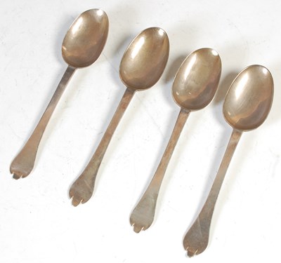 Lot 137 - A set of four William III silver Trefid spoons,...