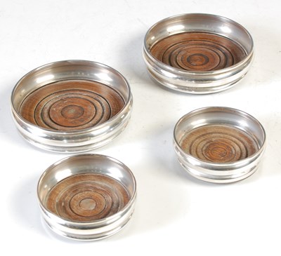 Lot 126 - A pair of London silver modern wine coasters,...