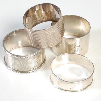 Lot 143 - Four various silver napkin rings, 3.1 troy ozs.
