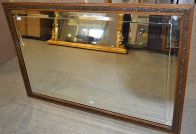 Lot 817 - An early 20th century carved oak frame...