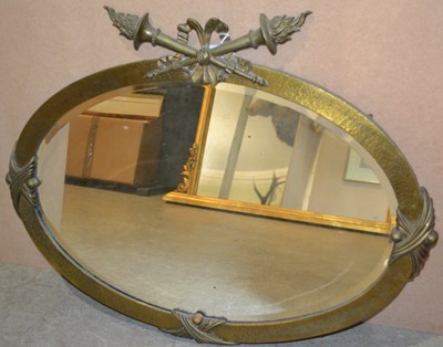 Lot 809 - A 20th century oval wall mirror, featuring...