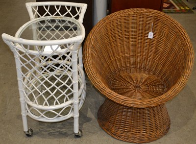 Lot 904 - A 20th century wicker lounge chair, raised on...