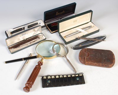 Lot 364 - A box of assorted pens and magnifying glasses,...