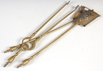 Lot 379 - A group of 3 19th century brass fire irons, to...
