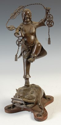 Lot 500 - A Chinese bronze figure of Bliu Hai dancing on...