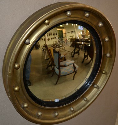 Lot 805 - A Regency style gilt convex mirror, with...
