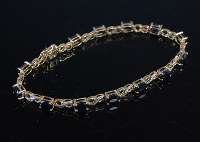 Lot 5 - A 9ct gold sapphire and diamond set...