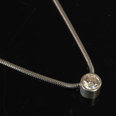 Lot 9 - A platinum and diamond set pendant necklace,...
