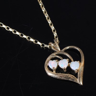 Lot 24 - A 9ct gold and opal set pendant necklace, the...