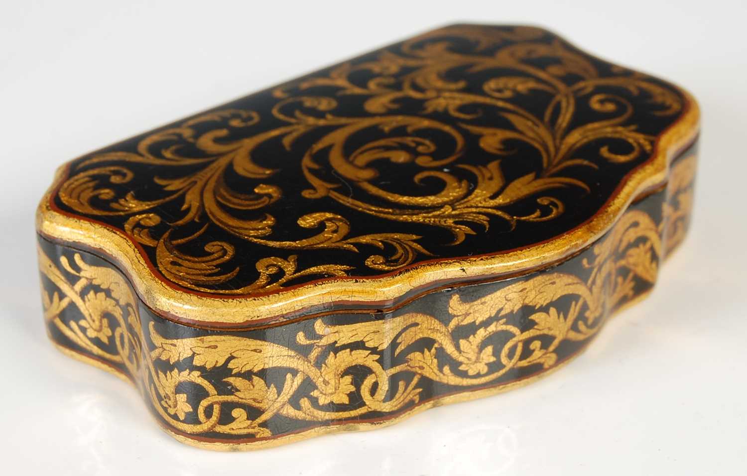 Lot 237 - A Mauchline ware cartouche-shaped snuff box,...