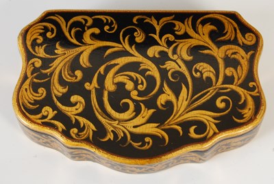 Lot 237 - A Mauchline ware cartouche-shaped snuff box,...