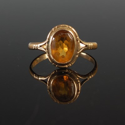 Lot 58 - A yellow metal and citrine set single stone...