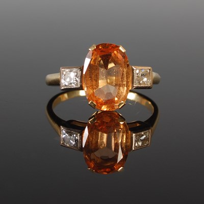 Lot 65 - A white and yellow metal topaz and diamond...