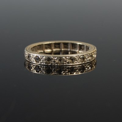 Lot 66 - A white metal and white sapphire set eternity...