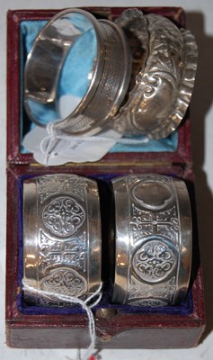 Lot 126 - A cased pair of Sheffield silver napkin rings,...