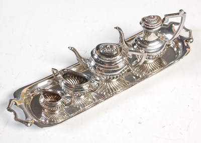 Lot 119 - A miniature London silver five piece miniature...