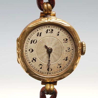 Lot 190 - A vintage 18ct gold wristwatch, the silvered...