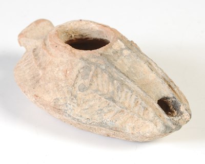 Lot 208 - An antique terracotta pottery oil lamp,...