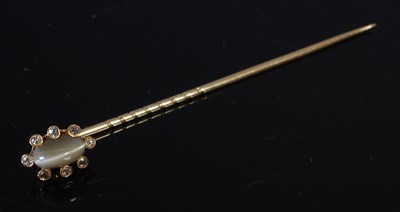 Lot 215 - A yellow metal tigers eye and diamond studded...