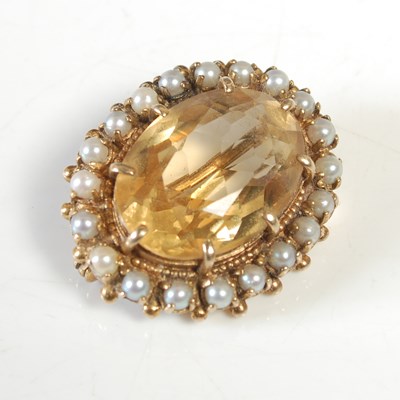 Lot 222 - A yellow metal citrine and split pearl brooch,...