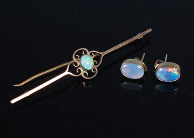 Lot 226 - A yellow metal and opal bar brooch, stamped...