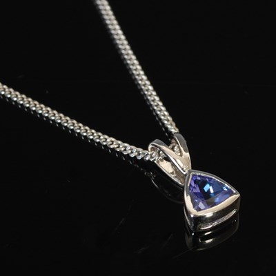 Lot 281 - A 9ct white gold and tanzanite pendant...