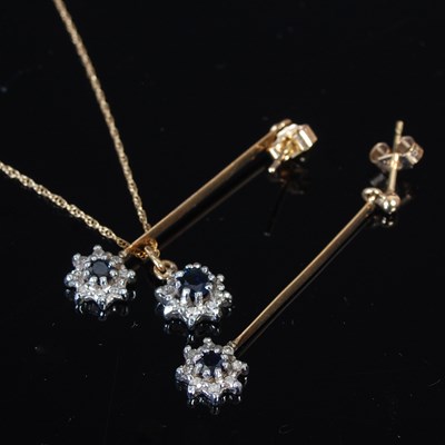 Lot 282 - A 9ct gold sapphire and diamond cluster...