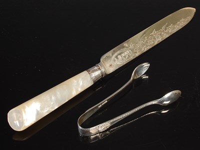 Lot 118 - A Sheffield silver bread knife, with mother of...