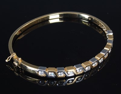 Lot 285 - Graham Stewart, an 18ct yellow and white gold...