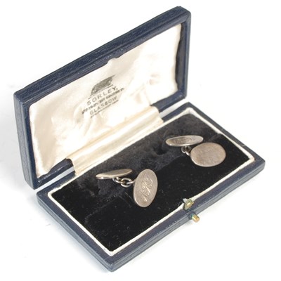 Lot 288 - A pair of white metal oval cufflinks, each...
