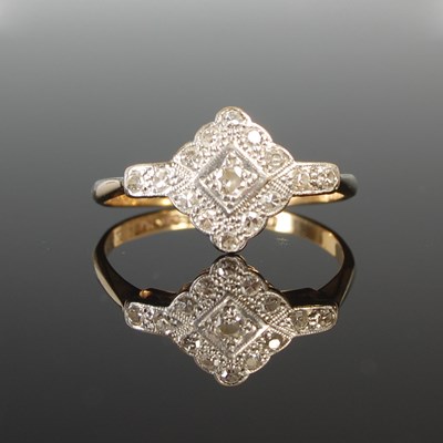 Lot 313 - A yellow and white metal diamond cluster ring,...