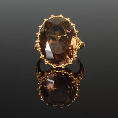 Lot 317 - A 9ct gold and smoky quartz ring, set with...