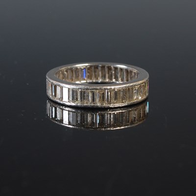 Lot 55 - A white metal and diamond set eternity ring,...